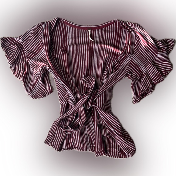 Free People Tops - Free People wrap top, size XS. Red and purple stripes. Short sleeves.